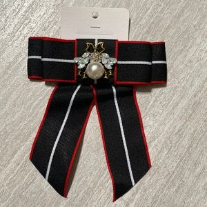 Brooch. Black, white and red.